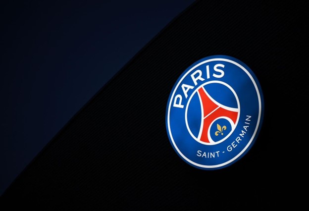 The logo of Paris Saint-Germain Football Club, featuring the Eiffel Tower and a fleur-de-lis on a red and blue background, with “PARIS” written at the top and “SAINT-GERMAIN” at the bottom.